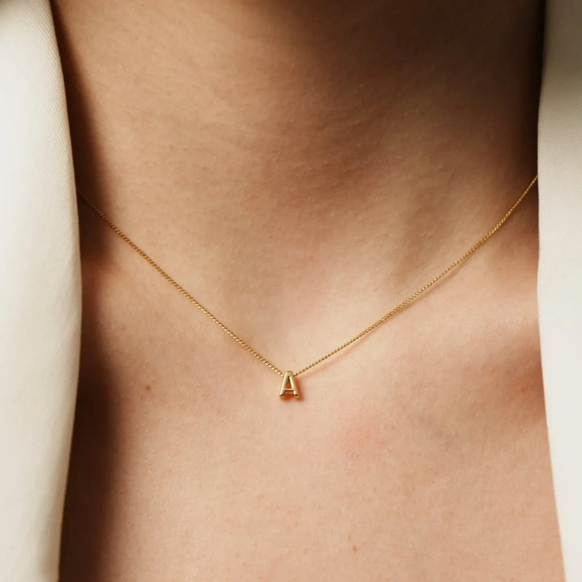 ESSENTIAL ARIAL LETTER NECKLACE